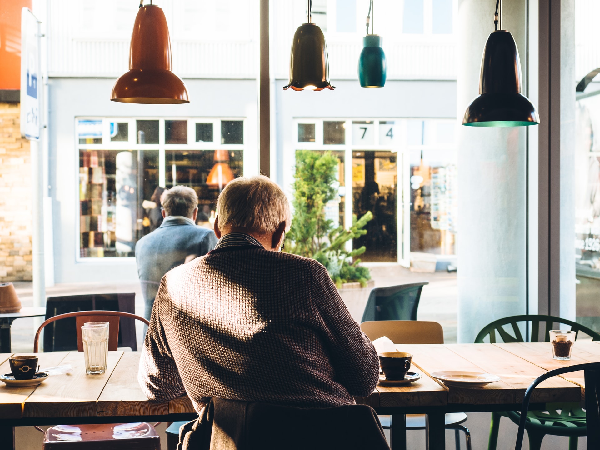 old man sitting in coffee shop