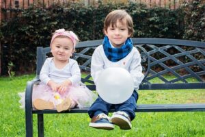 Two small children on a bench