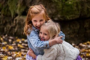 Two Children hugging in Autumn